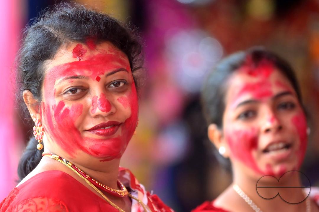 Married women smear each other with vermillion during a ritual called the vermillion game, or "Sindur Khela," on the last day of the Durga Puja festival in Agartala, Tripura, India.