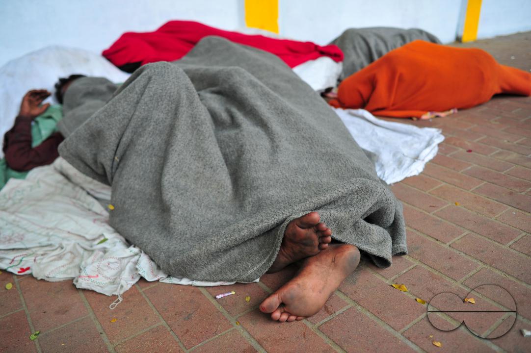 Covering their bodies from head to toe with whatever they can manage, homeless people sleep out in the open in the shivering cold near the Government Alia Madrasa in Sylhet city's Chowhatta area
