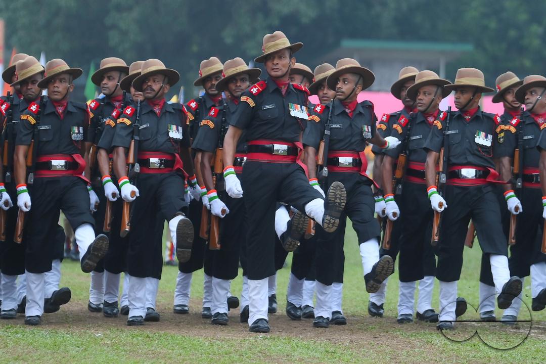 Soldiers of different platoons at the 77th Independence Day parade at the Assam Rifles ground in Agartala