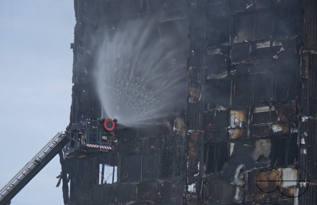 Fire brigade and community groups helping with fire disaster at  of Grenfell Tower in West London,UK