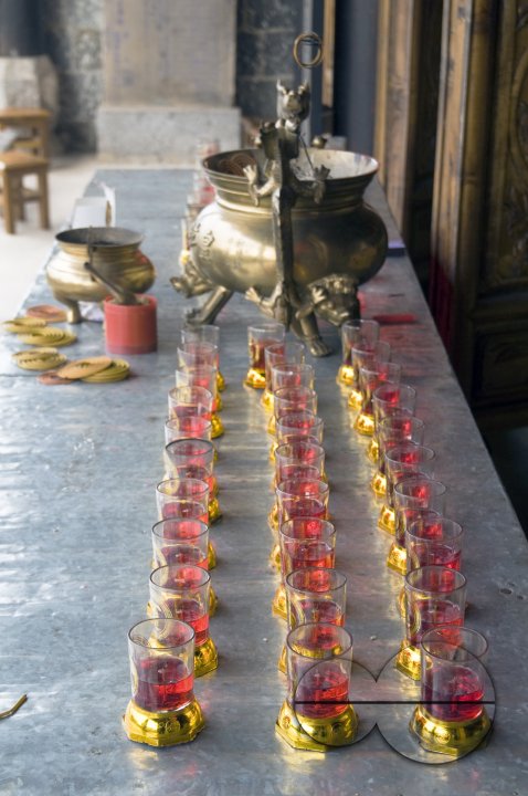 CHINA Altar with candles in a temple in a village in Yunnan province.