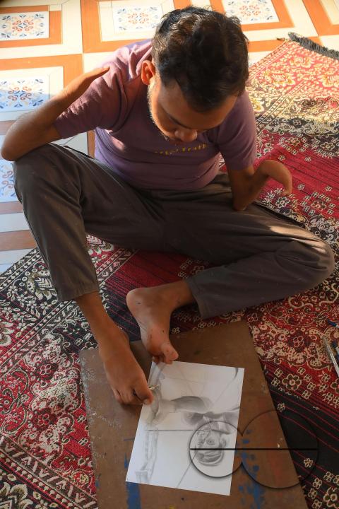 A 23-year-old differently abled artist Pralay Dey, is pursuing his bachelorâs degree in psychology from Tripura Central University
