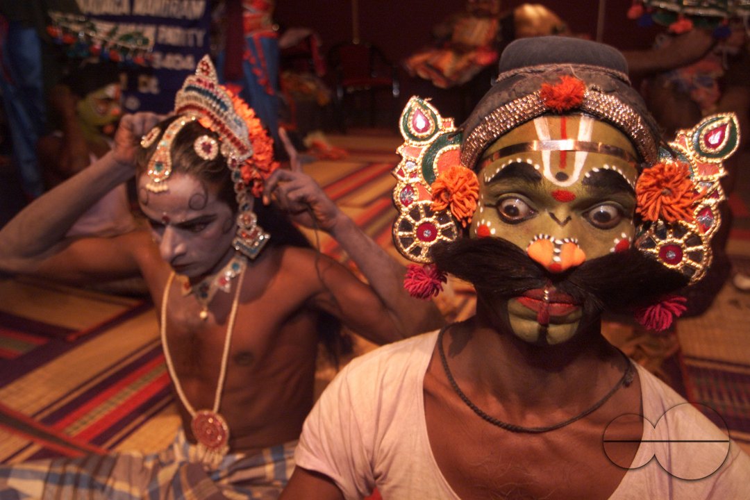 A south Indian dancer applies finishing touch before a stage show at a dance festival in Kolkata
