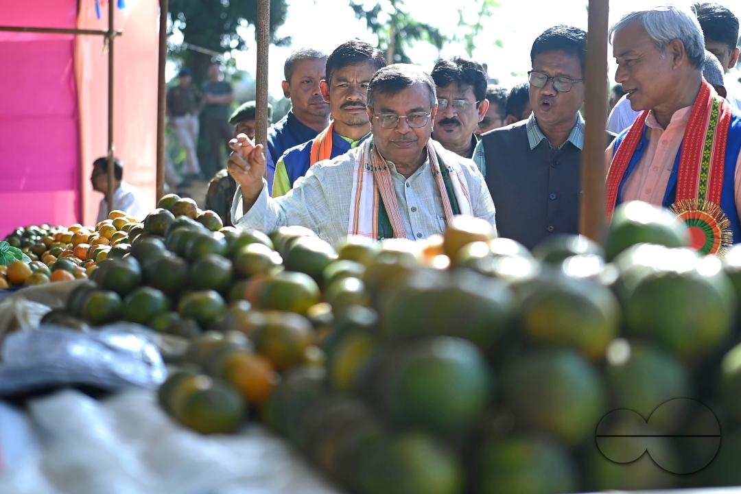 Minister for Agriculture and Farmers Welfare, Ratan Lal Nath inspects oranges during the Orange Festival in Taibaglai Village (Killa) organized by the Agriculture and Farmers Welfare of Tripura