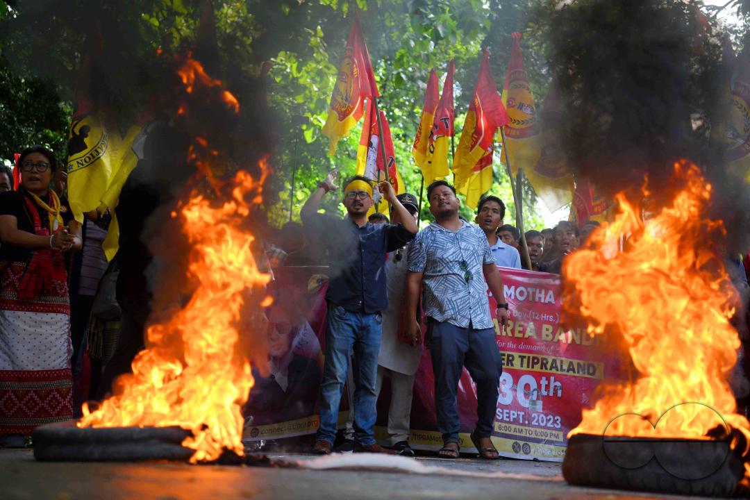 The âTipraha Indigenous Progressive Regional Alliance (TIPRA)ââ supporters raise slogans demanding a separate Greater Tipraland state for tribals, in Bermuda Ashram Para