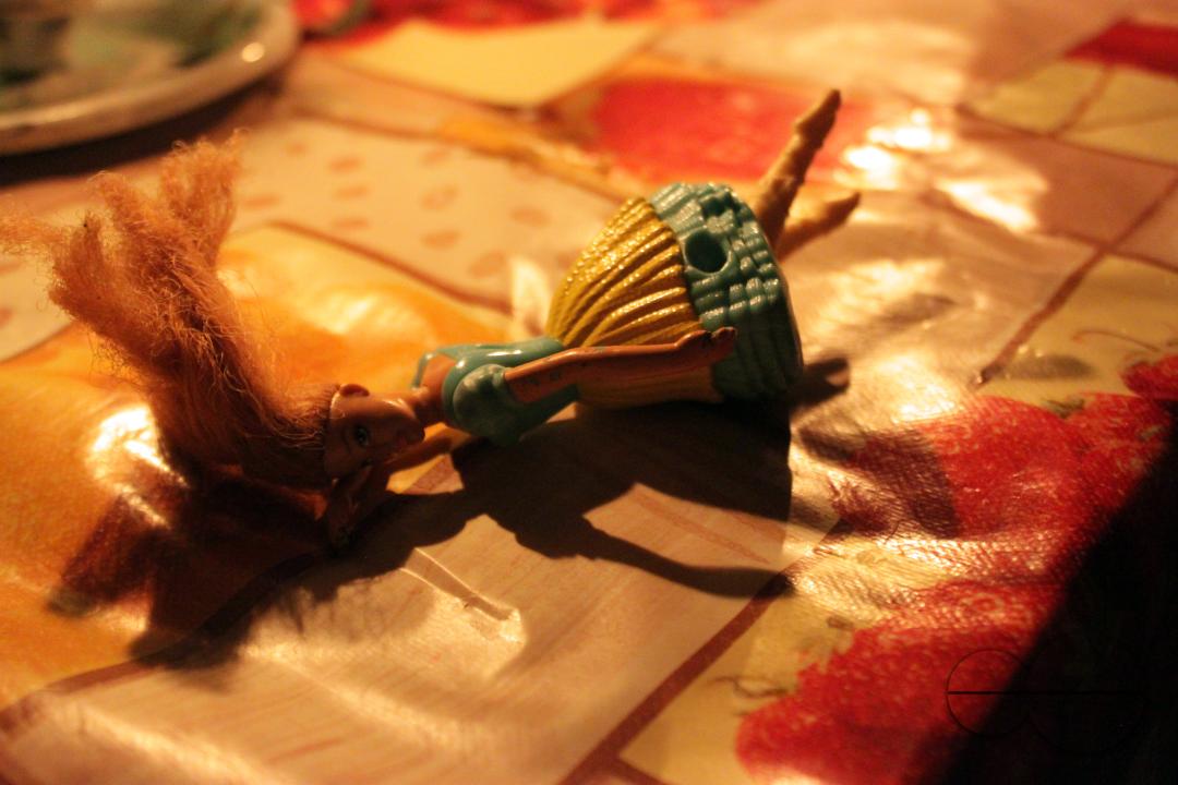 A doll on a table lit by candle light during times of loadshedding in Harare, Zimbabwe.
