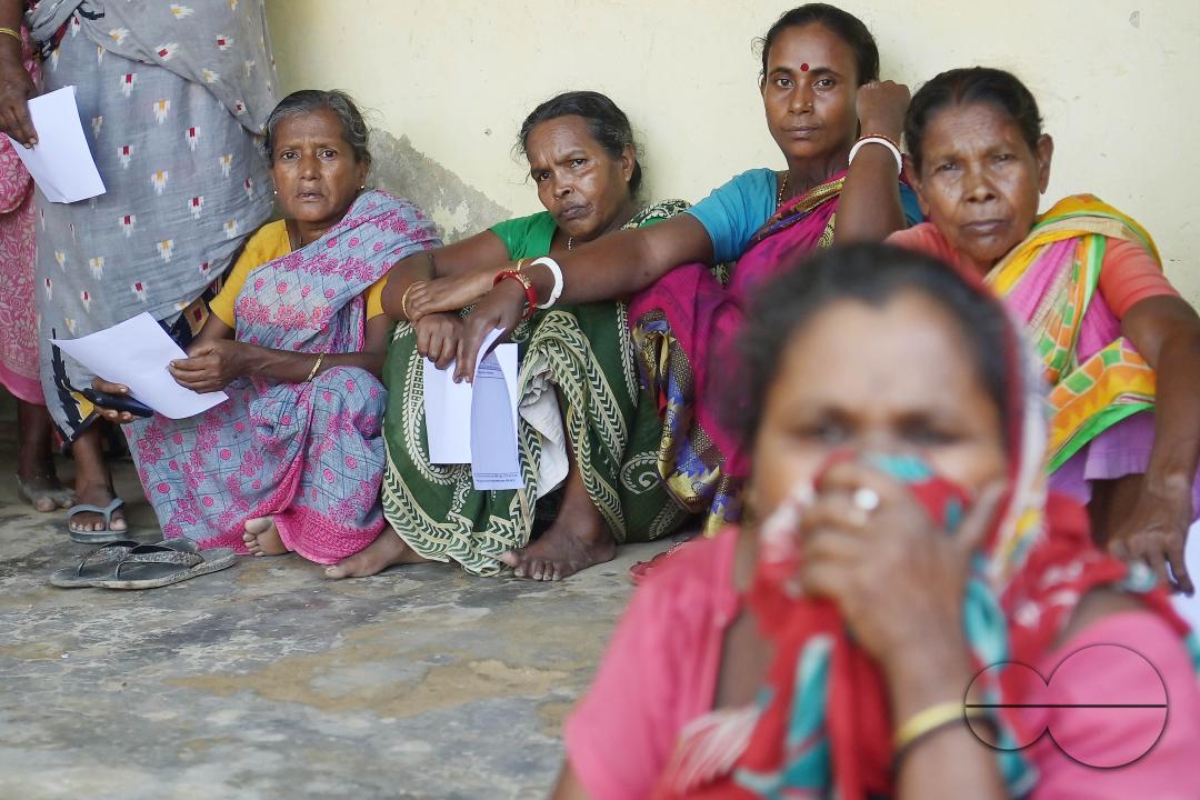 Flood victims are queuing up during a health check-up at a temporary relief camp