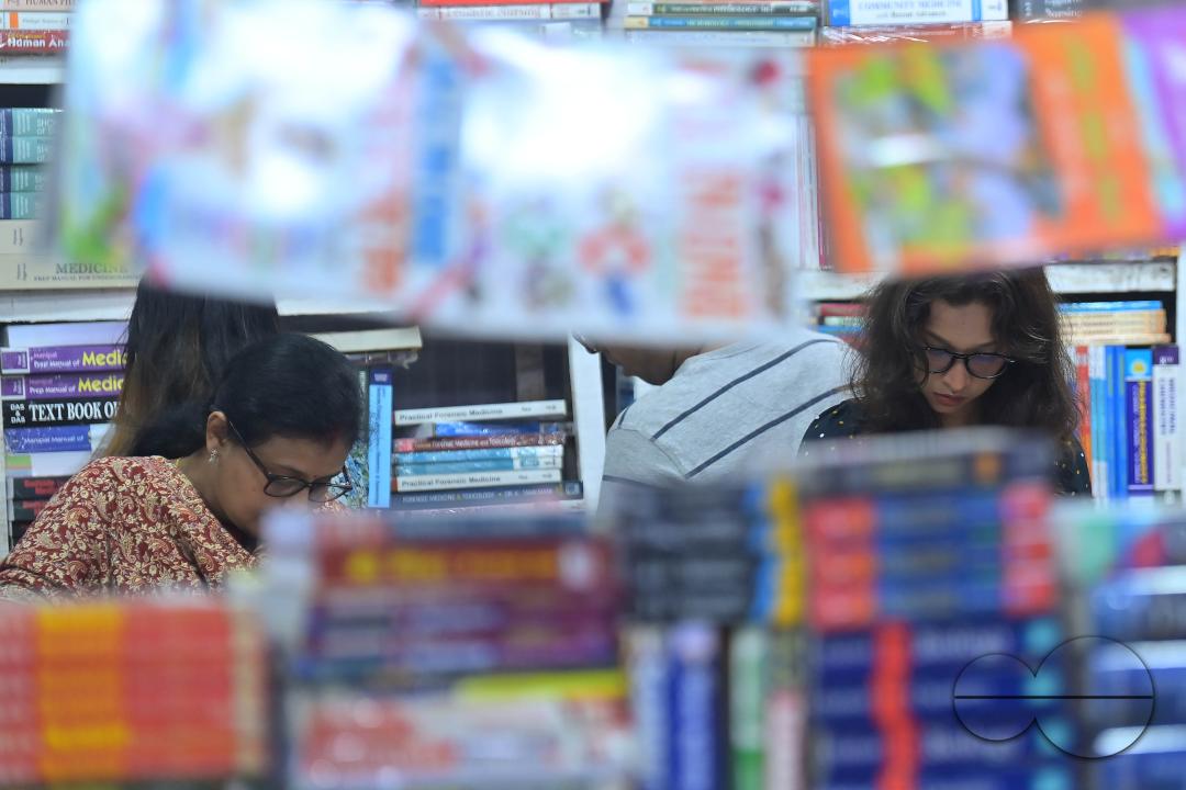 People looking at books in a book stall at the 42nd Agartala Book fair International Fair Ground, Hapania at Agartala