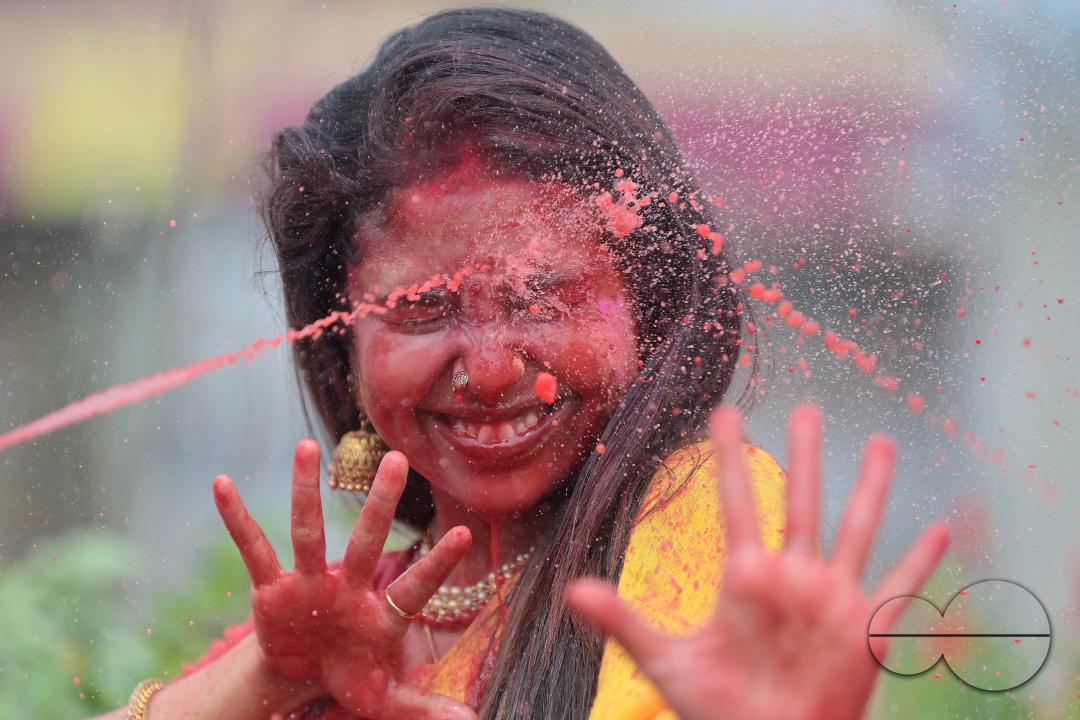 Indian girls adorned with 'Gulal' or coloured powder during the Hindu spring festival 'Holi', the festival of colour in Agartala