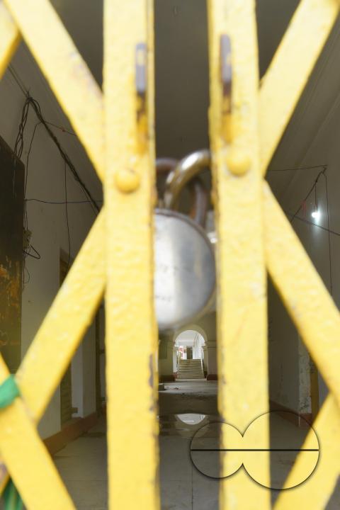 A locked gate of a government school during cyclone MidhiliÂ in Agartala