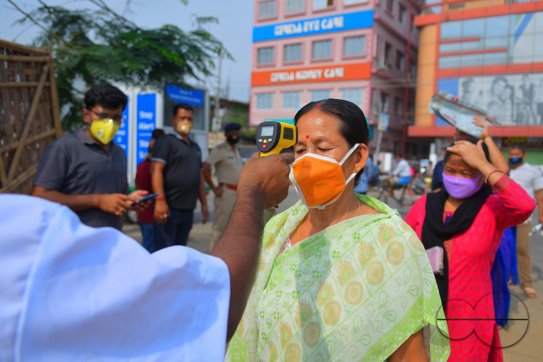 The health workers are applying infrared thermometer to check the temperatures