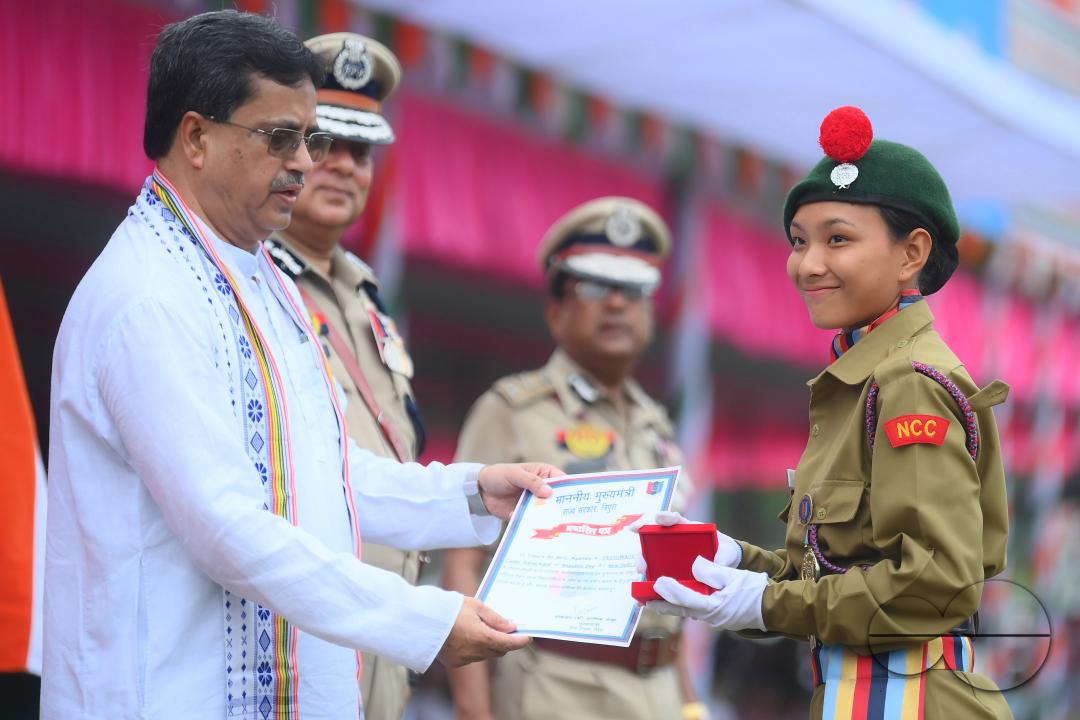 Tripura Chief Minister Manik Saha distributes awards and medals to the soldiers of different platoons during the 77th Independence Day function at the Assam Rifles ground in Agartala
