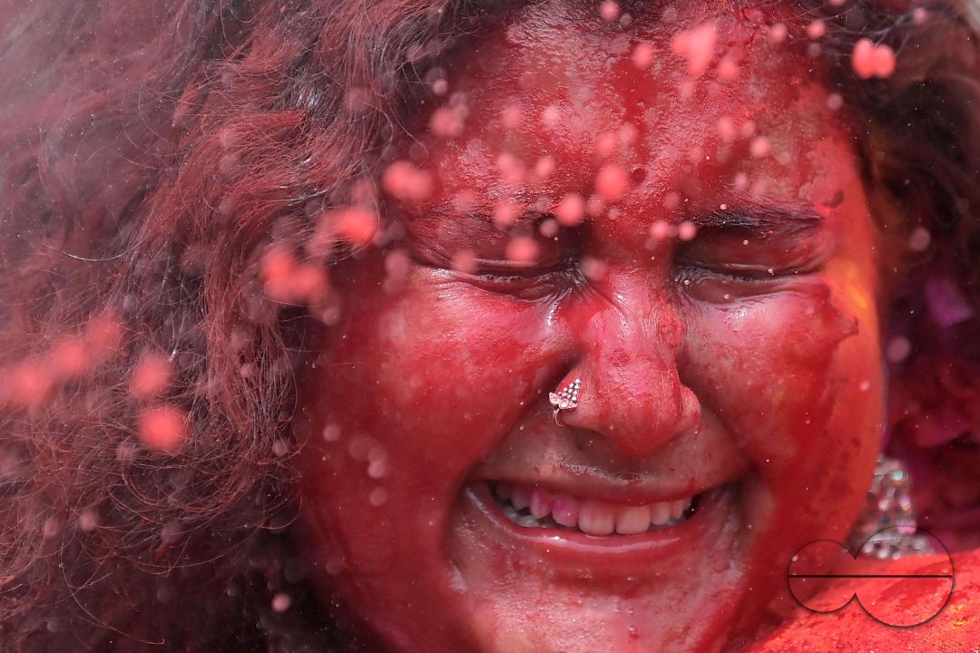 Indian girls adorned with 'Gulal' or coloured powder during the Hindu spring festival 'Holi', the festival of colour in Agartala