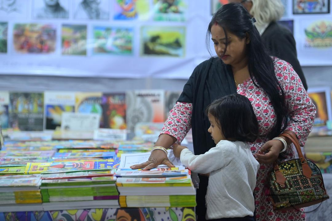 People looking at books in a book stall at the 42nd Agartala Book fair International Fair Ground, Hapania at Agartala