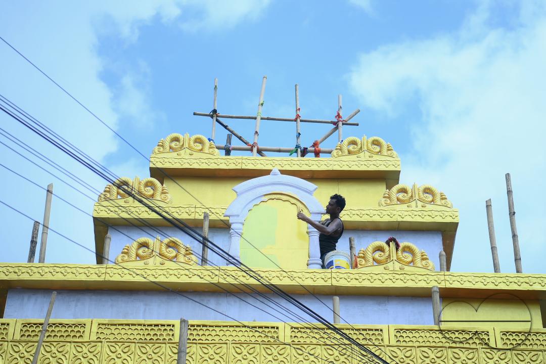 Workers are making a pandal, a temporary structure set up to usually venerate the God and Goddess, ahead of Ganesh Chaturthi festival in Agartala
