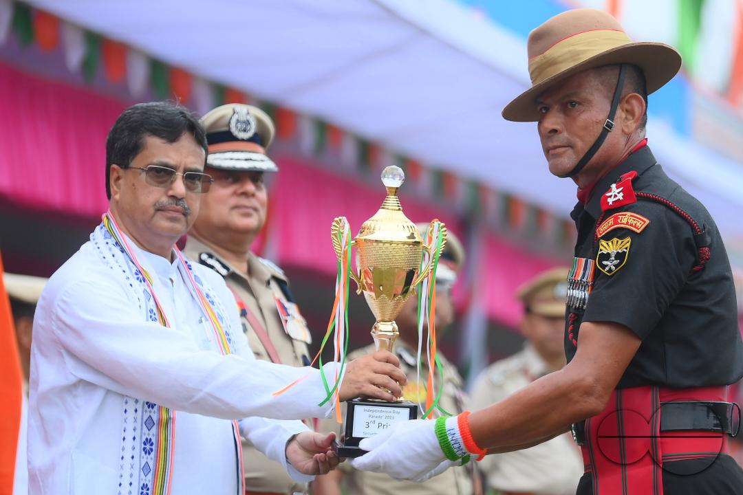 Tripura Chief Minister Manik Saha distributes awards and medals to the soldiers of different platoons during the 77th Independence Day function at the Assam Rifles ground in Agartala