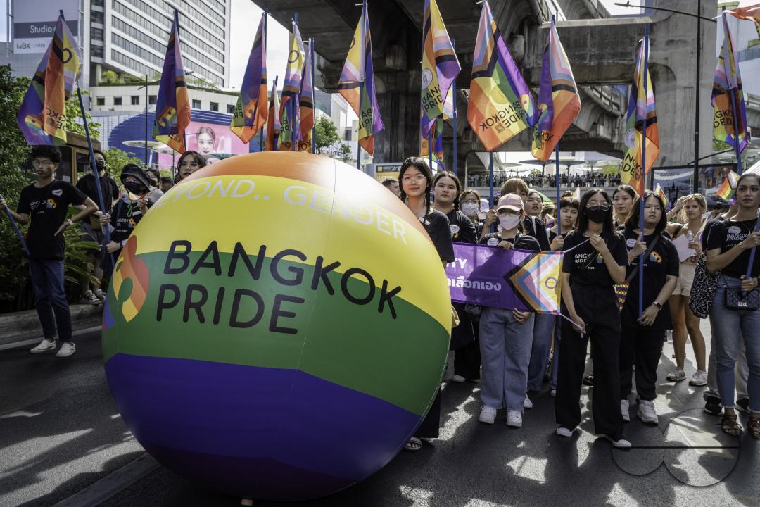 People are parading during Bangkok's Pride Parade 2023 behind the symbol and theme of the Bangkok Pride Parade 2023 "Beyond Gender", in Bangkok, Thailand.