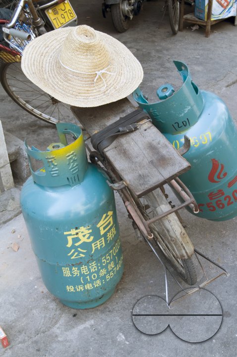 CHINA Migrant workers from the countryside working as self-employed street vendors of gas cylinders in Guangzhou, Guangdong province.
