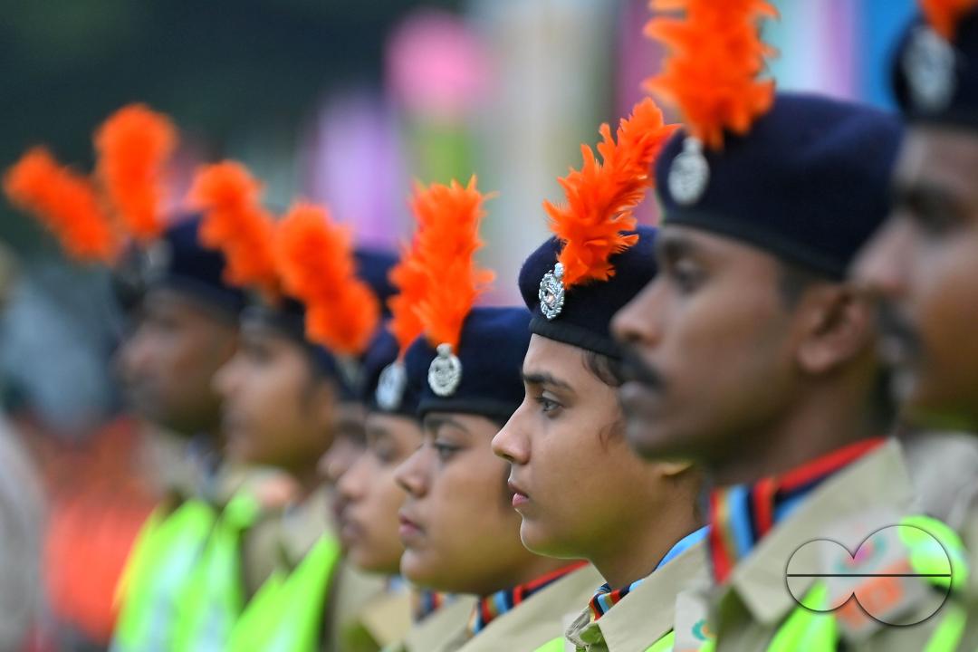 Troopers from the NDRF, Home Guards and Civil Defence take oath on the 61st All India Civil Defence and Home guards raising day at the police parade ground in Agartala