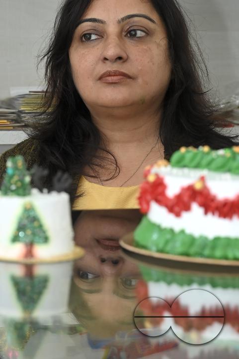 Sutapa Choudhary, a cake artist and teacher, making cakes at her cake parlour, "CREAMY DELIGHTS"