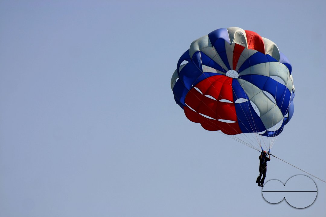 An Indian NCC trainee flies with Para suit on the eve of NCC day in Kolkata