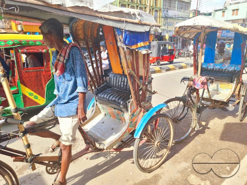 A rickshaw driver itaking a break at the local market, in Agartala
