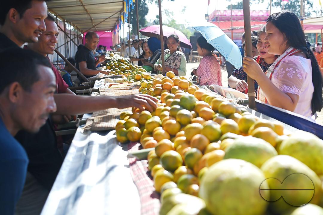 People are buying oranges during the Orange Festival in Taibaglai Village (Killa) organized by the Agriculture and Farmers Welfare of Tripura
