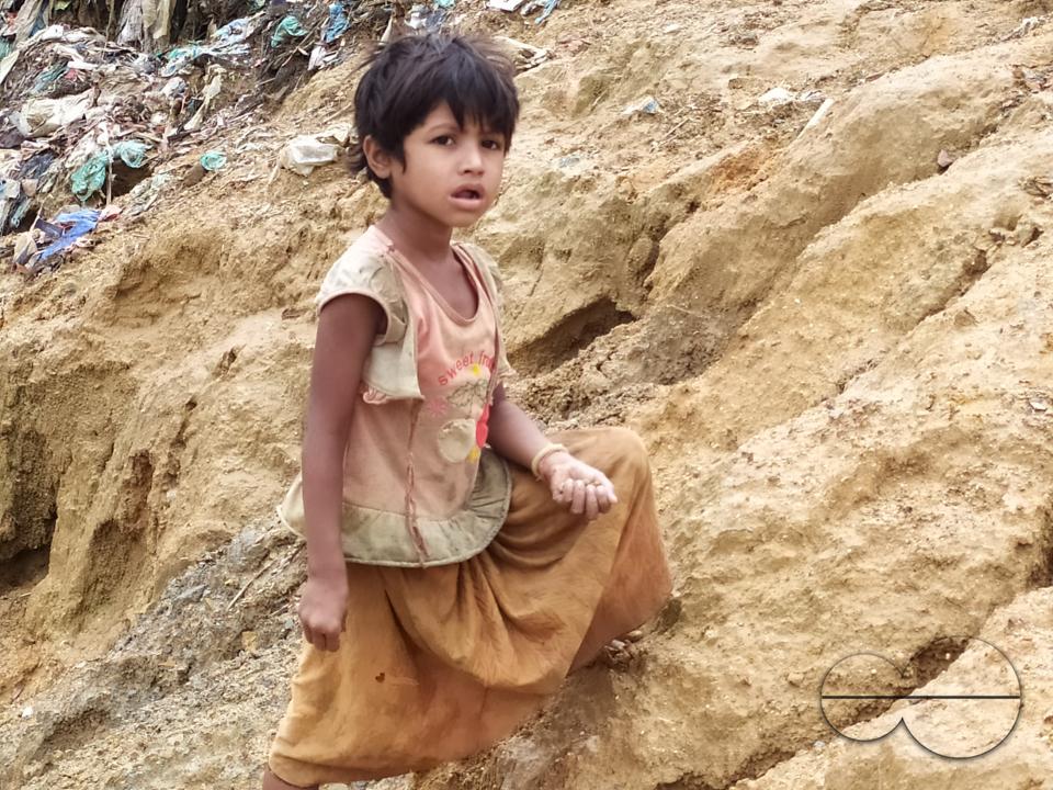 Portrait of a child at a garbage dump at the Balukhali refugee camp