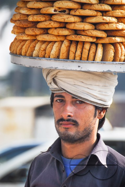 A man selling cookies, Lahore.