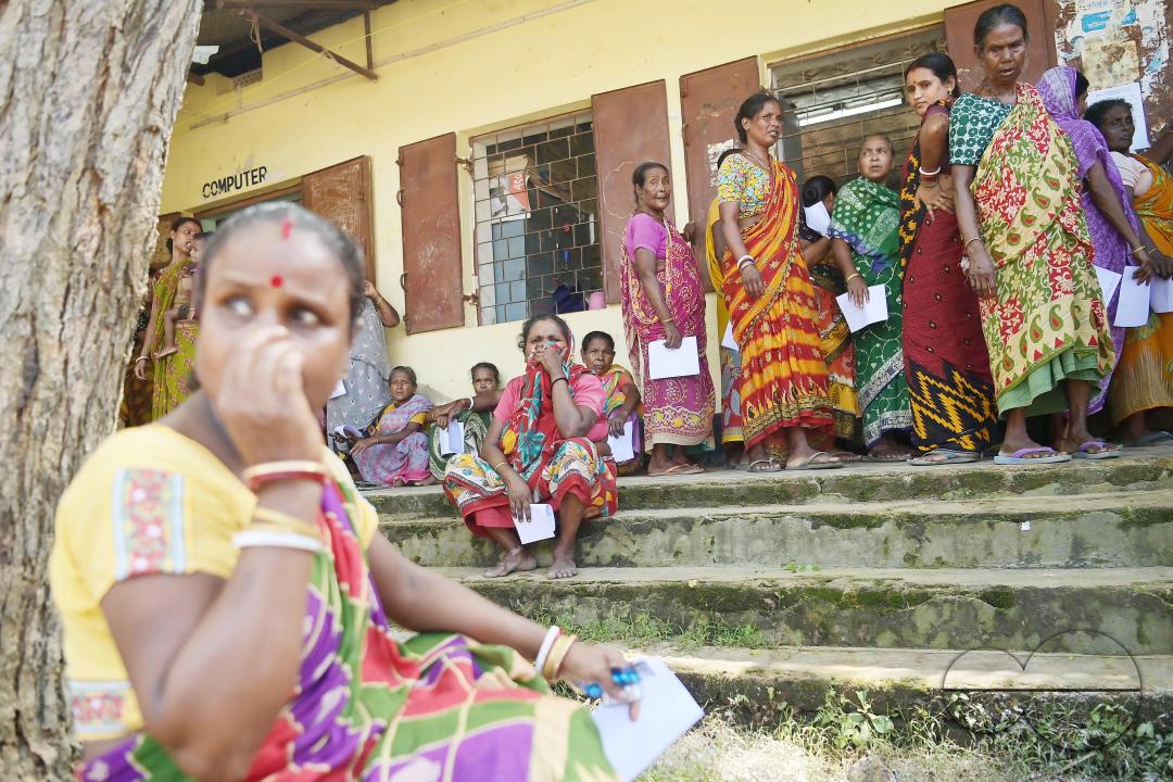 Flood victims are queuing up during a health check-up at a temporary relief camp
