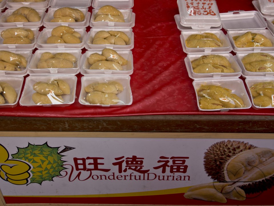 Durian fruit for sale in shops in Chinatown on the eve of Chinese New Year in Singapore