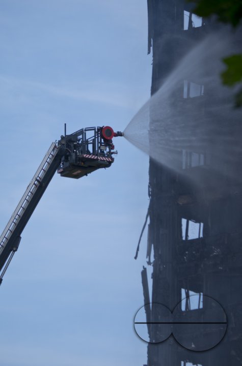 Fire brigade and community groups helping with fire disaster at  of Grenfell Tower in West London,UK