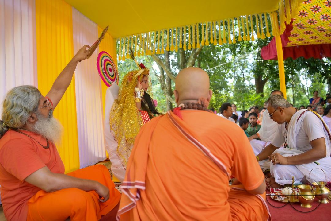 Priests worship a nine-year, five-month, and fourteen-day-old Hindu girl, Debalina Chakraborty, known as a "Kumari," who yawns during the Durga Puja religious festival at the Ramakrishna Vivekananda Ashram, operated by the Ramakrishna Mission on the outs