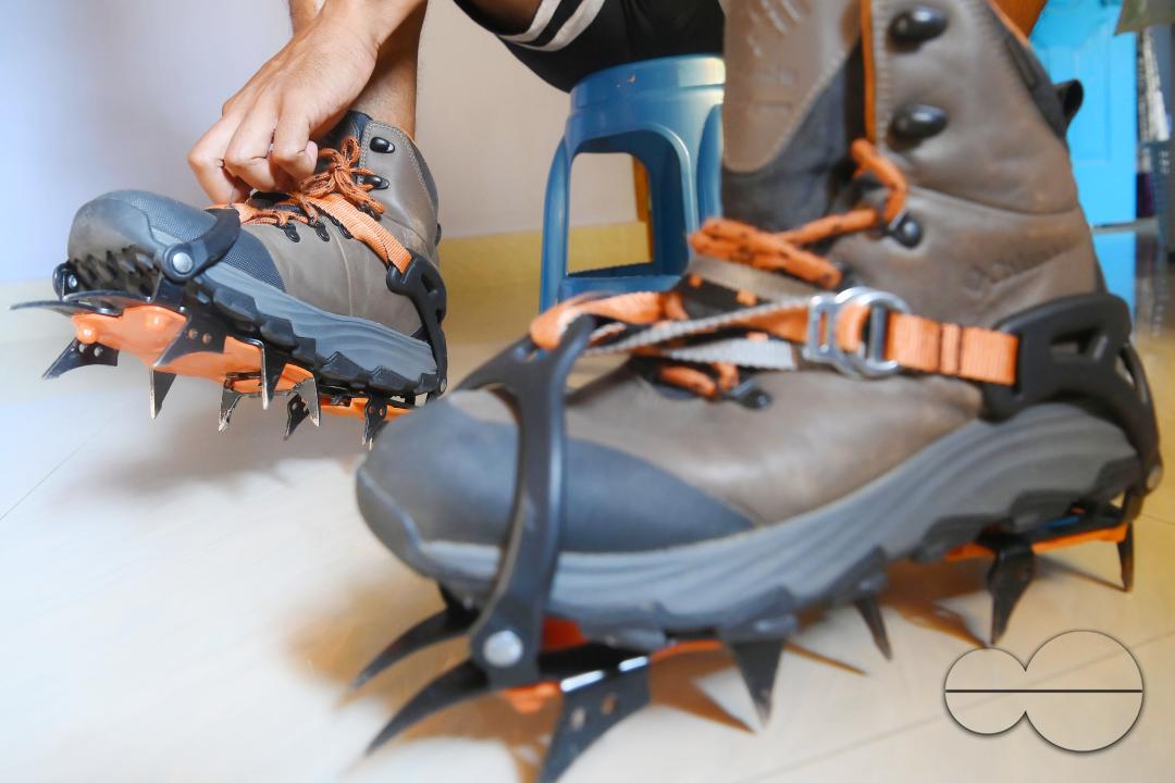 Aritra Roy, an IT professional and mountaineer, adjusting the spikes on his shoe after climbing the highest mountain in Europe, Mount Elbrus