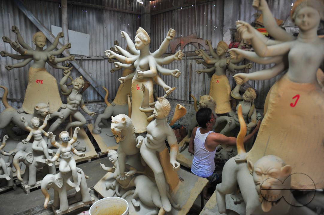 Nondi Pal, an idol artist is working on structures of Hindu Deity in preparation for the upcoming Durga Puja Festival 2023