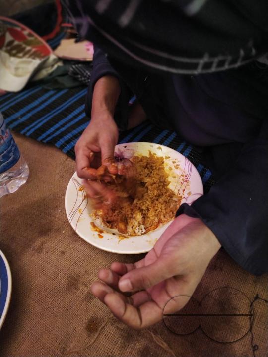 A woman eating at the Balukhali refugee camp