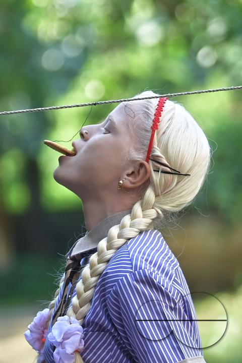 A student at the Institute for Visually Handicapped is participating in a 'Biscuit Race' during the 'Children's Day' celebration at the institute's campus in Narsingarh, in Agartala
