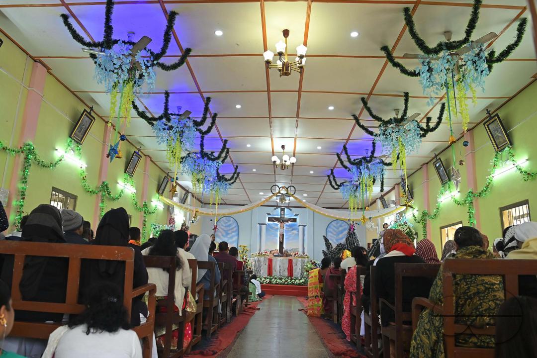 Christians attend a Christmas Mass in Mariam Nagar Church at Agartala