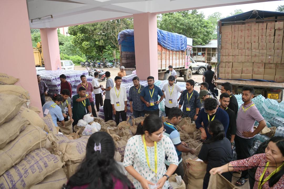 Government officials and workers are preparing food packets to be distributed by NDRF (National Disaster Response Force) personnel from helicopters to flood victims in different parts of Tripura