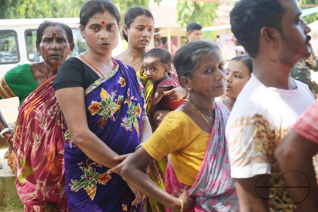 Flood victims are queuing up during a health check-up at a temporary relief camp