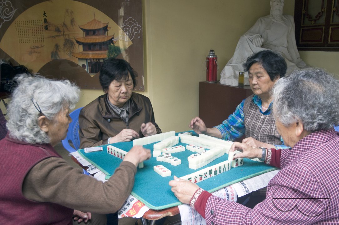 CHINA Elderly women playing mahjong in a park in Kunming, Yunnan province..