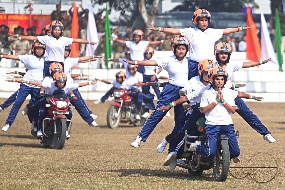 The female police motorcycle display team performs during the celebration of 150 years of Tripura Police Week at the stadium of A.D