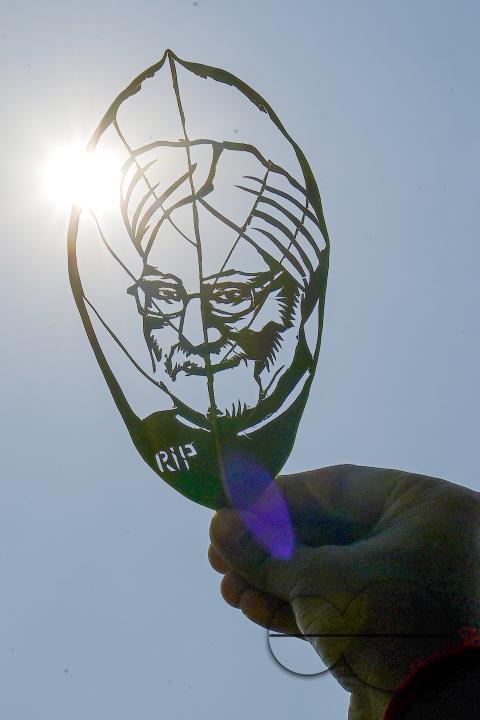 Artist Subham Saha shows his artwork, paying tribute to former prime minister Manmohan Singh, who passed away recently