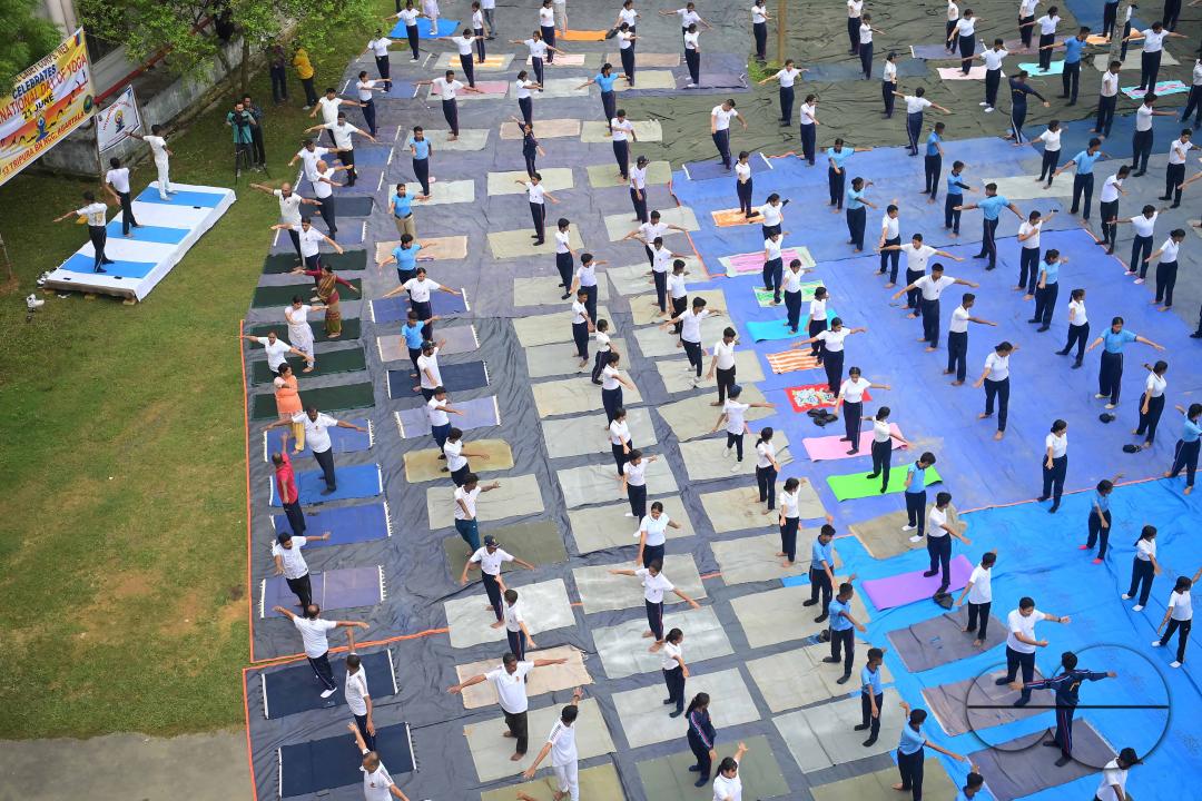 NCC cadets and officials perform yoga during 10th International Day of Yoga Day at BBM College Ground in Agartala
