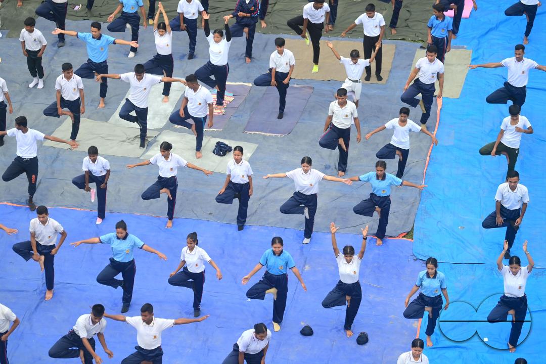 NCC cadets and officials perform yoga during 10th International Day of Yoga Day at BBM College Ground in Agartala