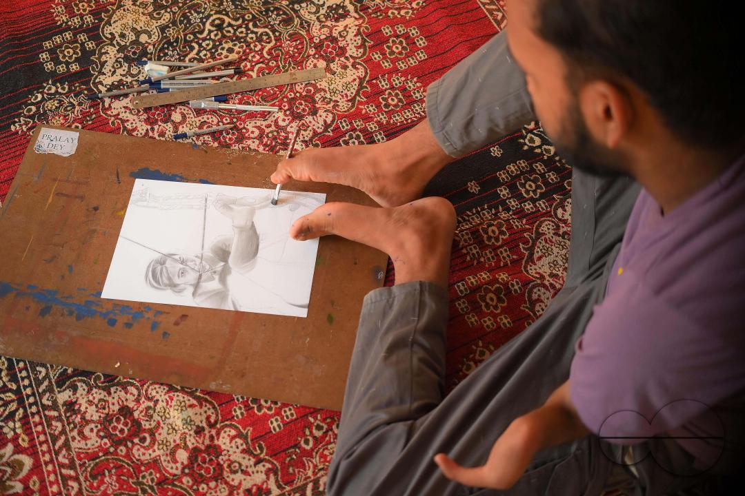 A 23-year-old differently abled artist Pralay Dey, is pursuing his bachelorâs degree in psychology from Tripura Central University