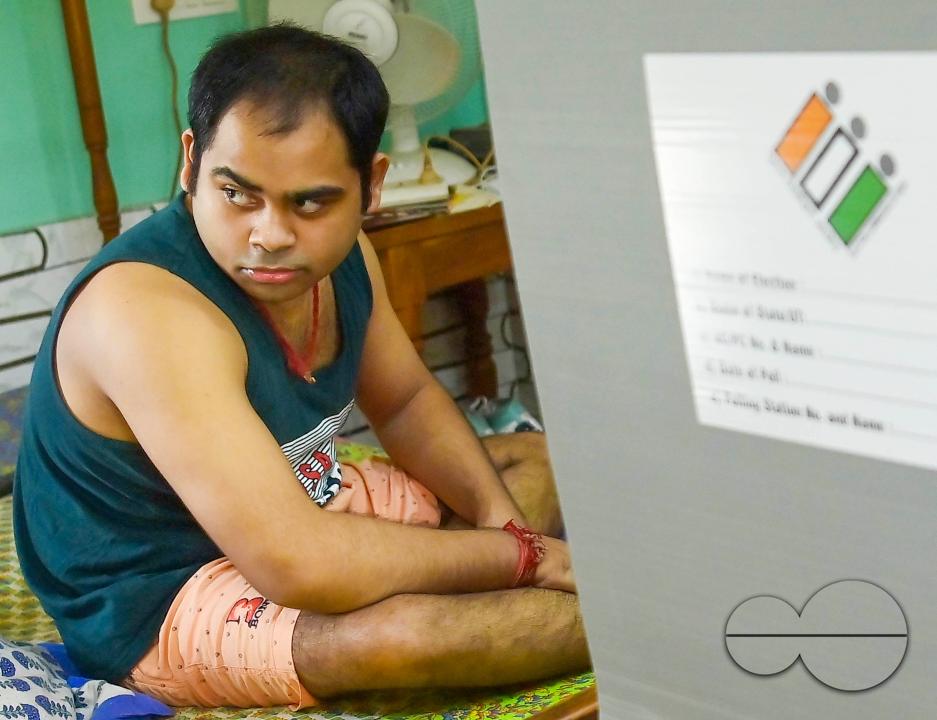 A differently abled boy casting his postal ballot vote at his house in front of the team of election officials and security personnel in Agartala