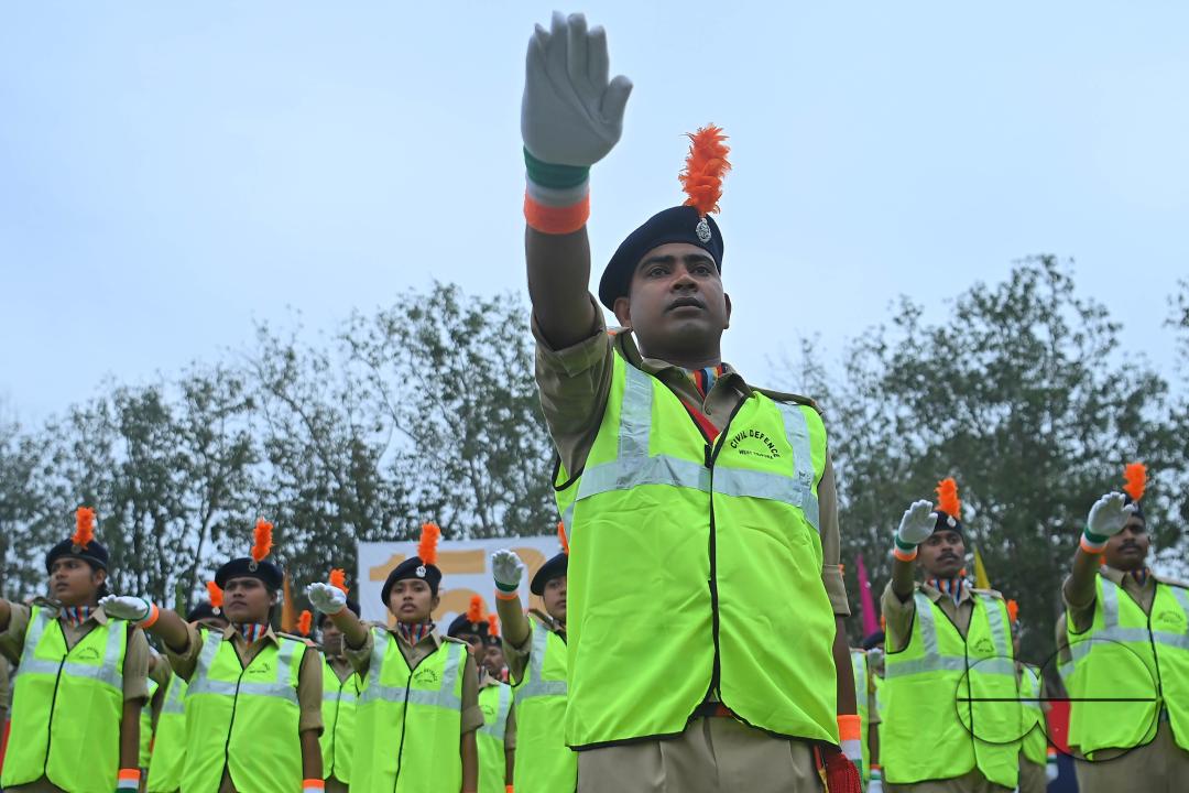 Troopers from the NDRF, Home Guards and Civil Defence take oath on the 61st All India Civil Defence and Home guards raising day at the police parade ground in Agartala