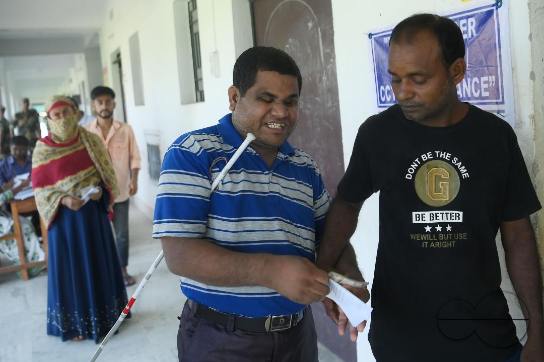 A blind voter at the by-elections for the Boxonagar assembly seat, in Tripura Sepahijala district