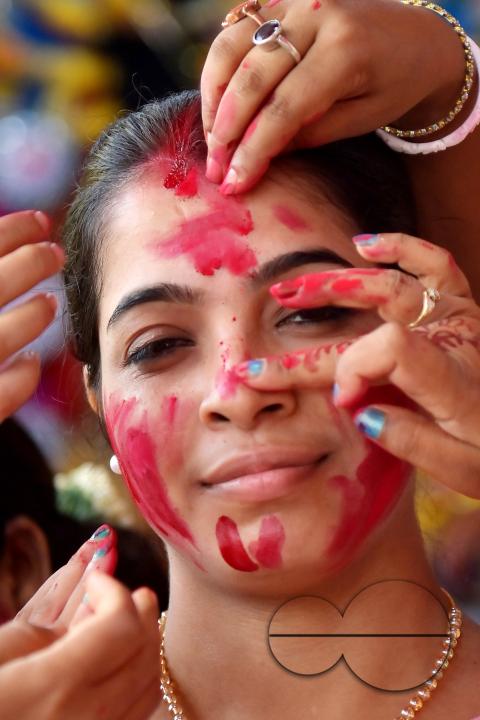 Married women smear each other with vermillion during a ritual called the vermillion game, or "Sindur Khela," on the last day of the Durga Puja festival in Agartala, Tripura, India.